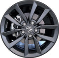 Close-up of a car wheel rim with a Honda logo on a white background