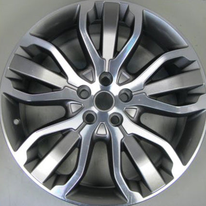 A silver multi-spoke alloy car wheel rim photographed from the front on a plain light background.