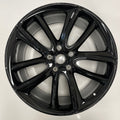 Gloss Black alloy wheel on a white background