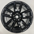 Gloss Black alloy wheel on a white background