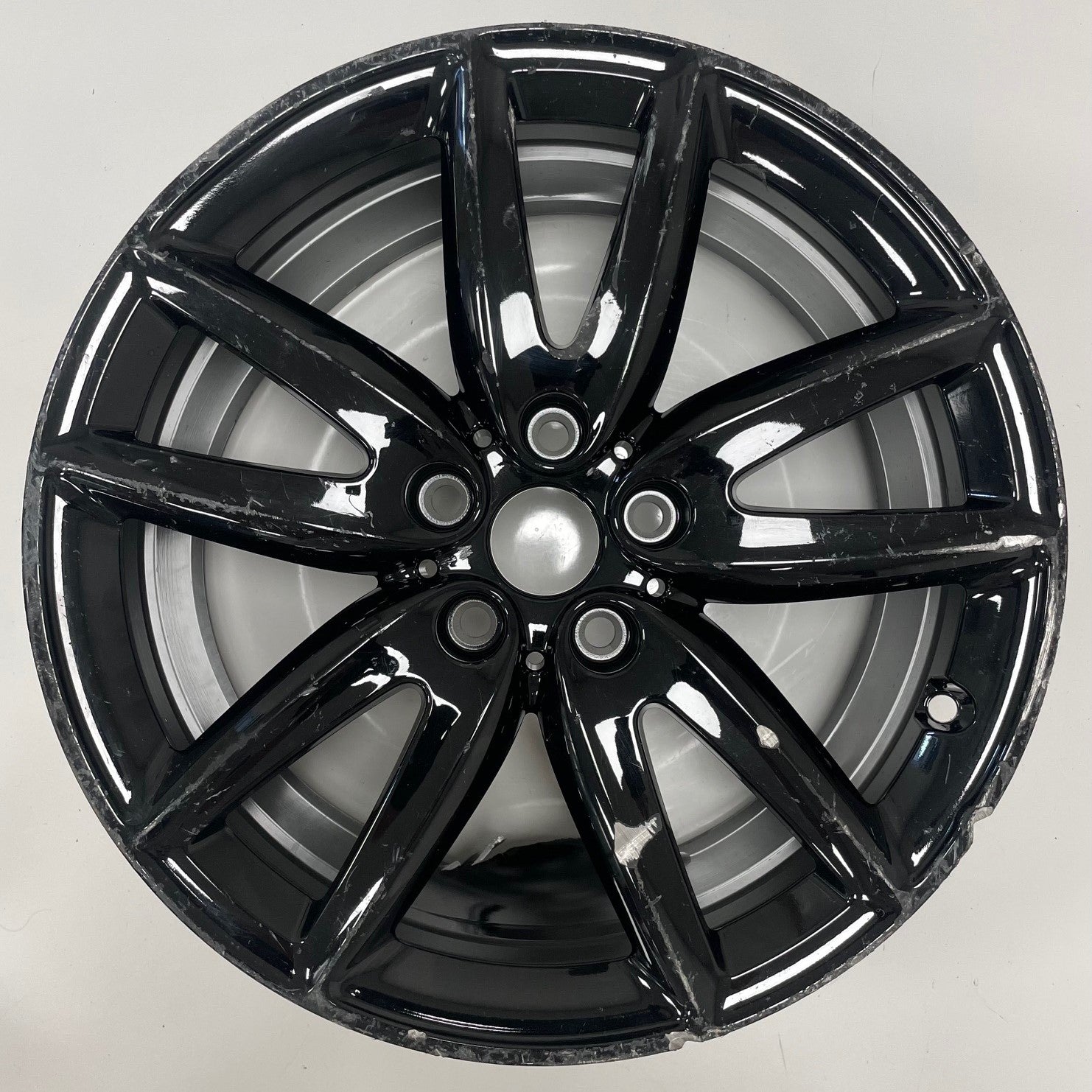 Gloss Black alloy wheel on a white background