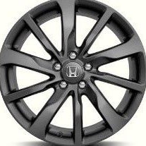 Black alloy wheel with a brand logo on a white background