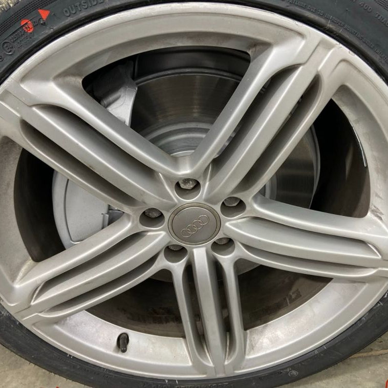 Close-up of a car wheel with a silver alloy rim.