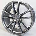 Car wheel rim with Volkswagen logo on a white background