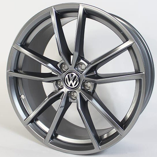 Car wheel rim with Volkswagen logo on a white background