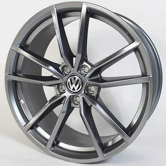 Car wheel rim with Volkswagen logo on a white background