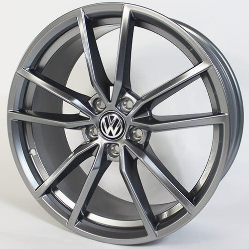 Car wheel rim with Volkswagen logo on a white background