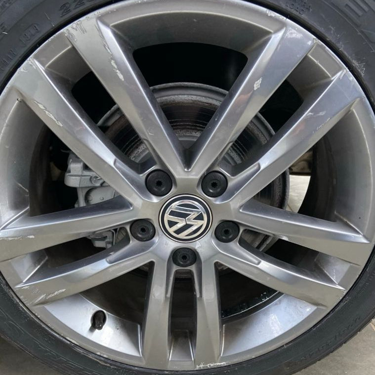 Close-up of a Volkswagen alloy wheel with visible hubcap.