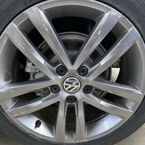 Close-up of a Volkswagen alloy wheel with visible hubcap.