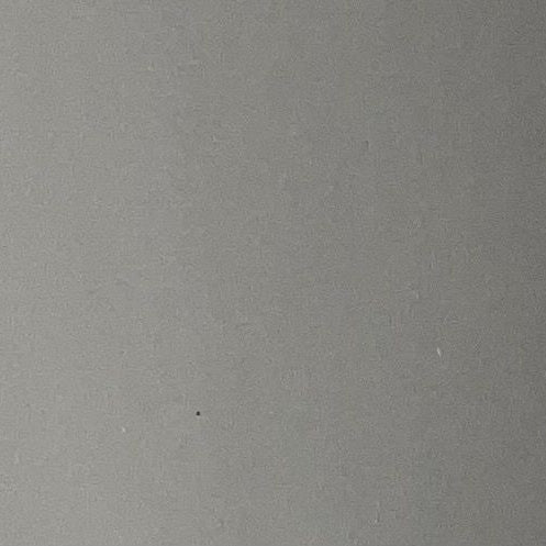 A solid, neutral gray textured surface filling the entire frame.