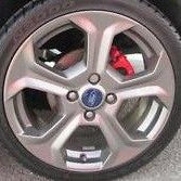 Car wheel with visible brand logo on a clear background