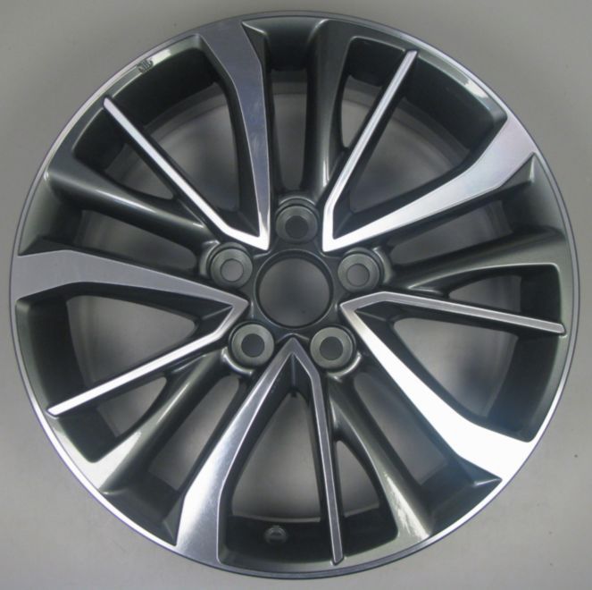 Car wheel rim with a metallic finish on a gray background