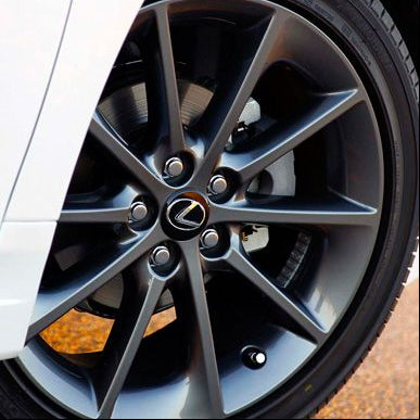 Close-up of a Lexus car wheel on a road