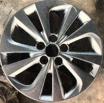 Close-up of a car wheel rim with a metallic finish