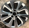 Close-up of a car wheel rim with a metallic finish