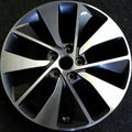 Car wheel rim with metallic finish on a black background