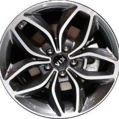 Close-up of a black alloy wheel with a visible brand logo.